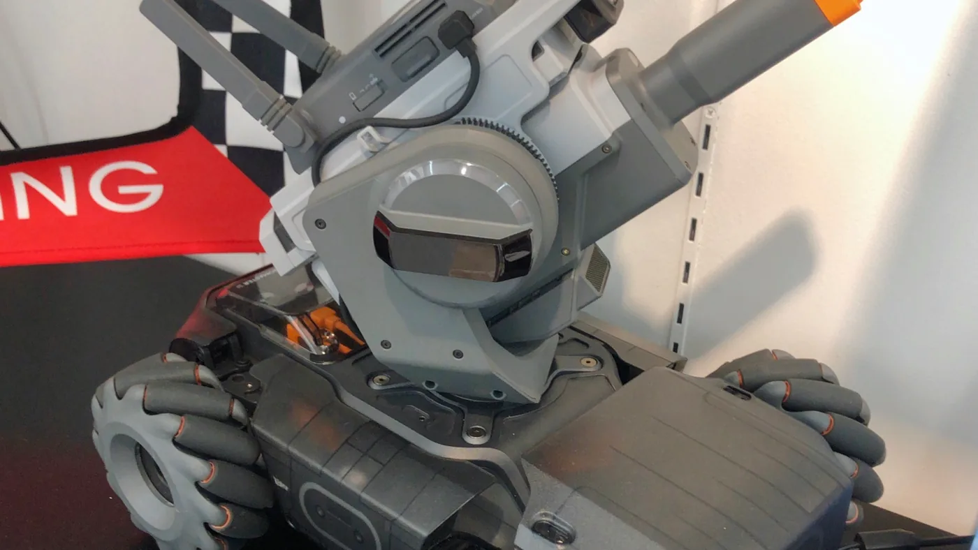 Close-up of a real RoboMaster S1 with the camera lens on the front of the gimbal filling the frame